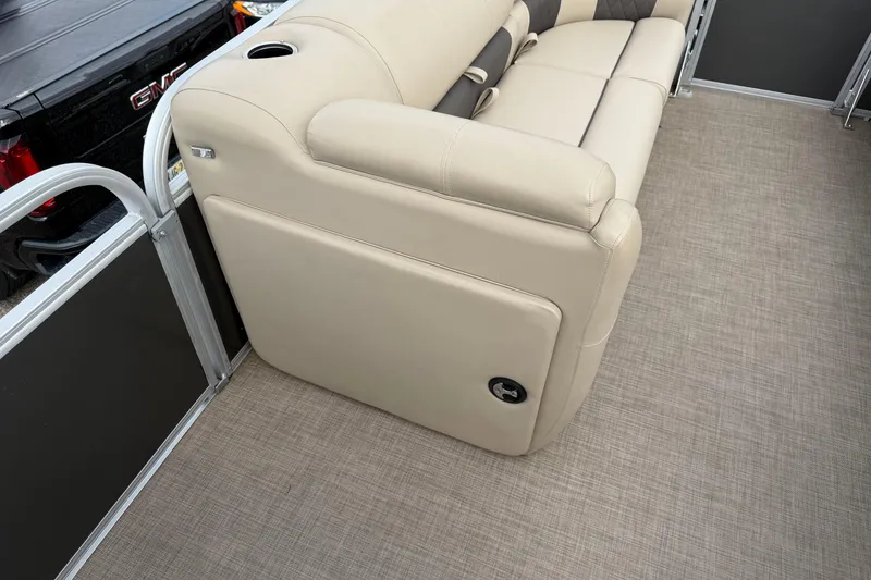 Slide: The Image of 2022 Sun Tracker Party Barge 20 DLX interior with beige seating and flooring. - 7