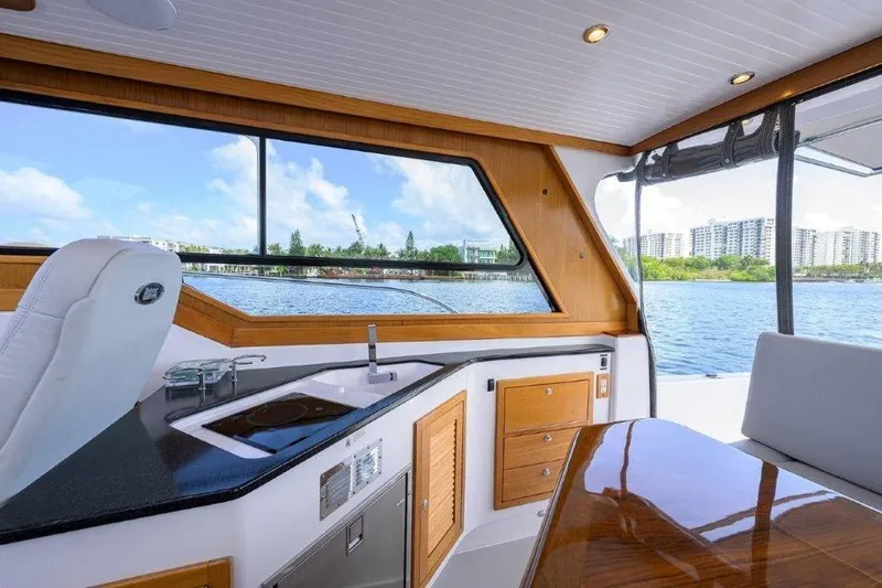 Slide: The Image of Interior of 2022 True North 34 boat with kitchen and scenic water view. - 56