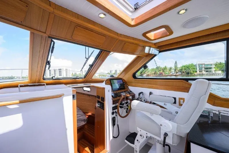 Slide: The Image of Luxurious 2022 True North 34 yacht interior with modern helm and panoramic windows. - 62