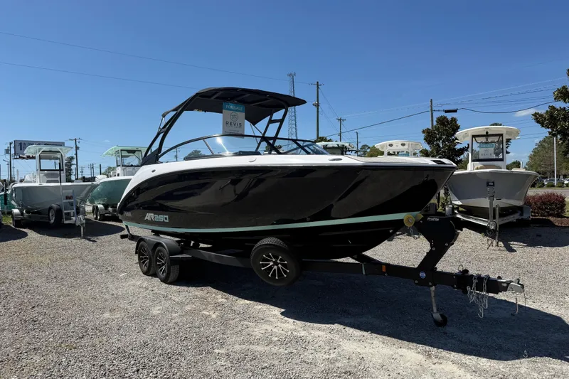 Slide: The Image of 2023 Yamaha Boats AR250 on trailer, displayed outdoors for sale. - 11