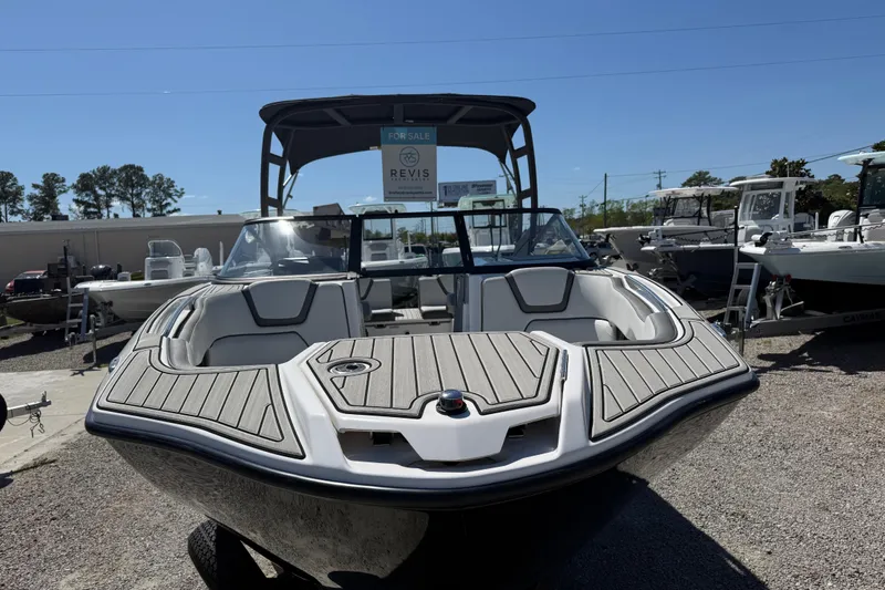 Slide: The Image of 2023 Yamaha Boats AR250 on display, featuring sleek design and spacious seating. - 13