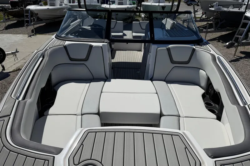 Slide: The Image of 2023 Yamaha Boats AR250 interior with spacious seating and modern design. - 14