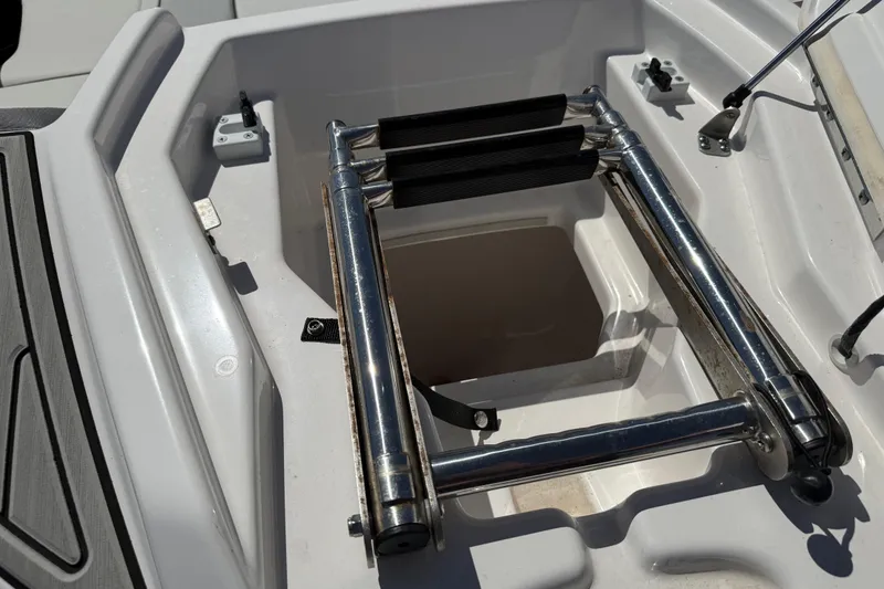 Slide: The Image of 2023 Yamaha AR250 boat ladder compartment with stainless steel hardware. - 15
