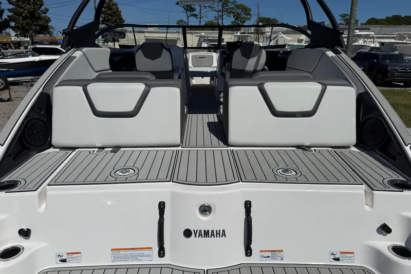 Slide: The Image of 2023 Yamaha Boats AR250 interior with sleek seating and modern design. - 16