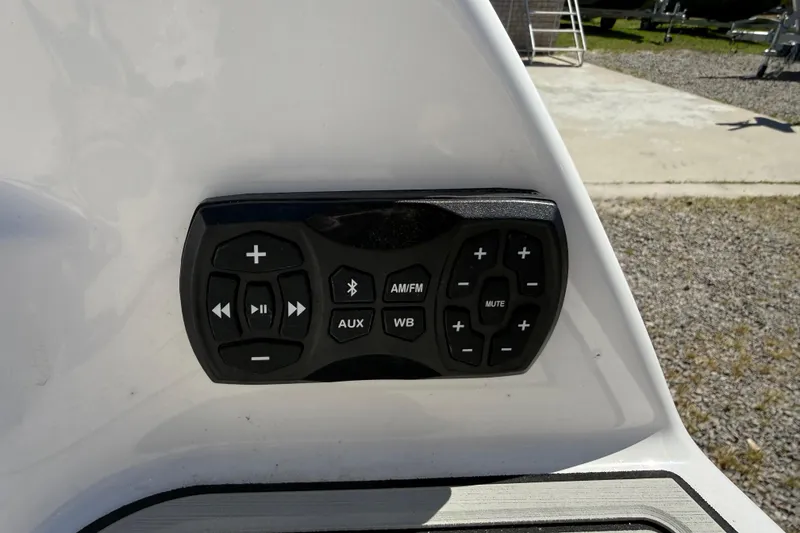 Slide: The Image of Control panel on 2023 Yamaha Boats AR250, featuring audio and Bluetooth functions. - 17