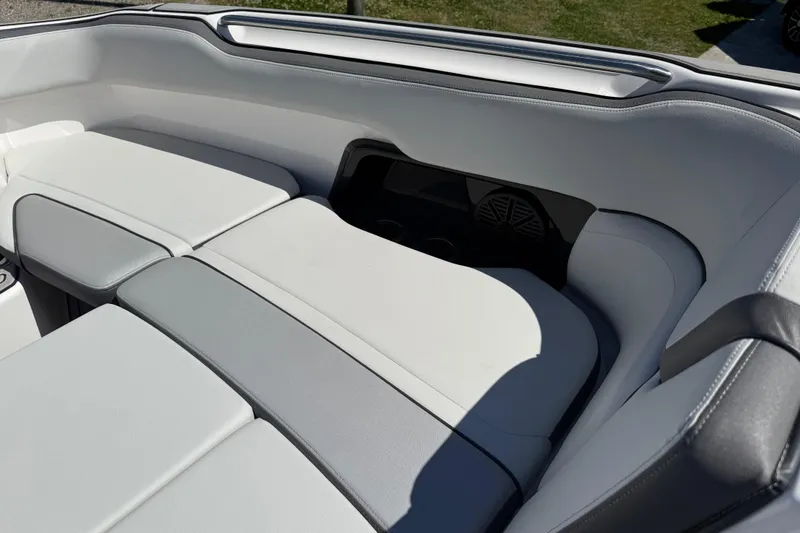 Slide: The Image of 2023 Yamaha Boats AR250 interior seating with sleek, modern design and comfortable upholstery. - 21