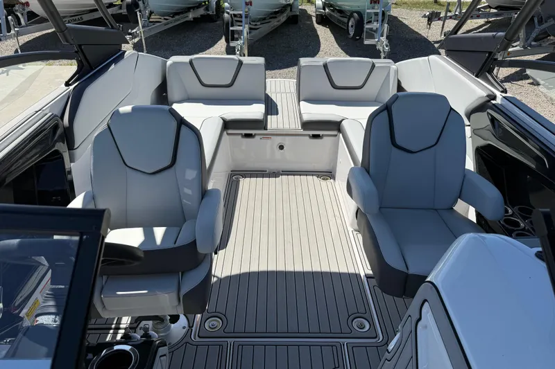 Slide: The Image of 2023 Yamaha Boats AR250 interior with sleek seating and modern design. - 22