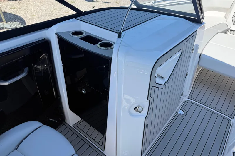 Slide: The Image of 2023 Yamaha Boats AR250 interior with cup holders and sleek design. - 28