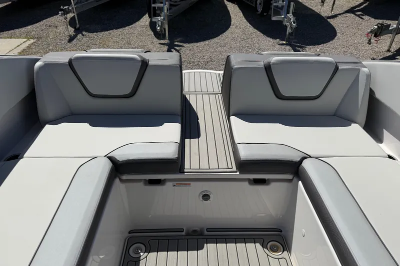 Slide: The Image of 2023 Yamaha Boats AR250 interior seating with sleek, modern design and gray upholstery. - 34