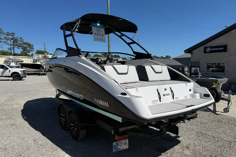 Slide: The Image of 2023 Yamaha Boats AR250 for sale, displayed outdoors on a trailer. - 4