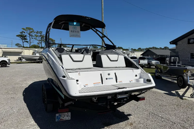 Slide: The Image of 2023 Yamaha Boats AR250 on trailer, displayed outdoors, available for sale. - 5