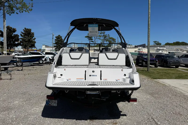 Slide: The Image of 2023 Yamaha AR250 boat displayed outdoors, rear view, for sale. - 6