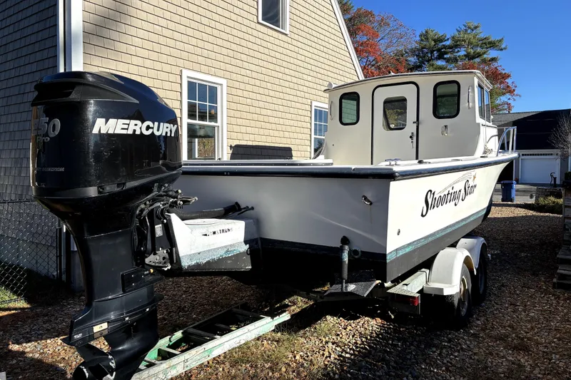 Slide: The Image of 2004 C-Hawk 25 Sport Cabin boat with Mercury engine on trailer. - 3