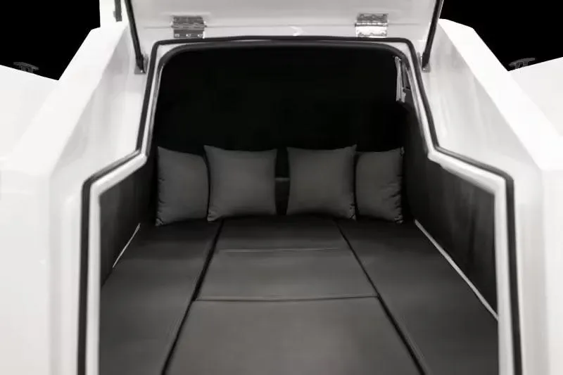 Slide: The Image of Manufacturer Provided Image: 2025 Iron 907 interior with sleek black seating and cushions. - 5