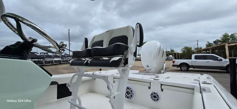 Slide: The Image of 2026 Tidewater 2500 Carolina Bay with modern seating and outboard motor. - 14