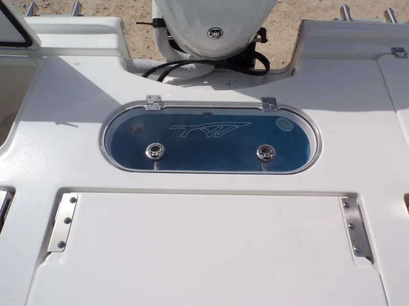Slide: The Image of Tidewater 2500 Carolina Bay 2026 boat rear with storage compartment. - 28