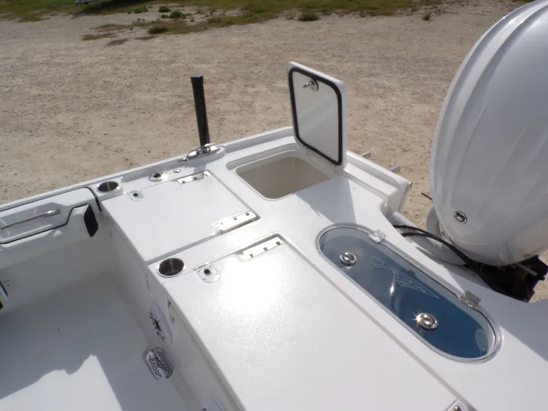 Slide: The Image of Tidewater 2500 Carolina Bay 2026 boat rear with motor and storage. - 31