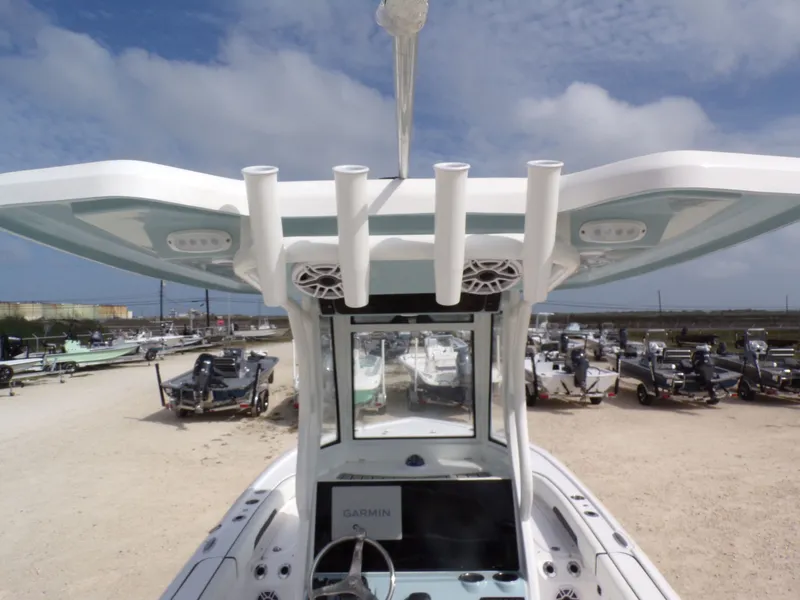 Slide: The Image of 2026 Tidewater 2500 Carolina Bay boat with rod holders and helm console. - 5