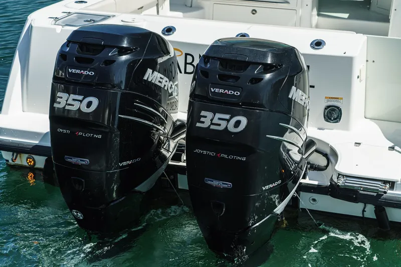 Slide: The Image of Twin Mercury Verado 350 engines on a 2016 Boston Whaler 315 Conquest boat. - 11