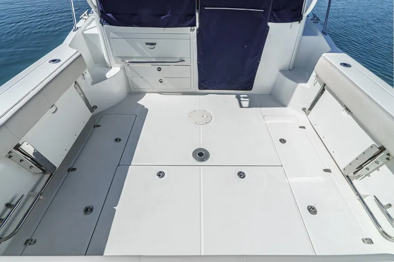 Slide: The Image of Spacious deck of 2016 Boston Whaler 315 Conquest boat, featuring storage compartments. - 21