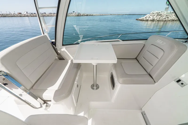 Slide: The Image of Interior seating area of 2016 Boston Whaler 315 Conquest boat with ocean view. - 30