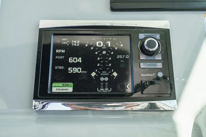 Slide: The Image of Dashboard display of a 2016 Boston Whaler 315 Conquest boat, showing RPM and system status. - 33
