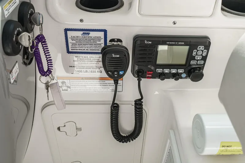 Slide: The Image of Control panel of a 2016 Boston Whaler 315 Conquest with VHF marine radio. - 37