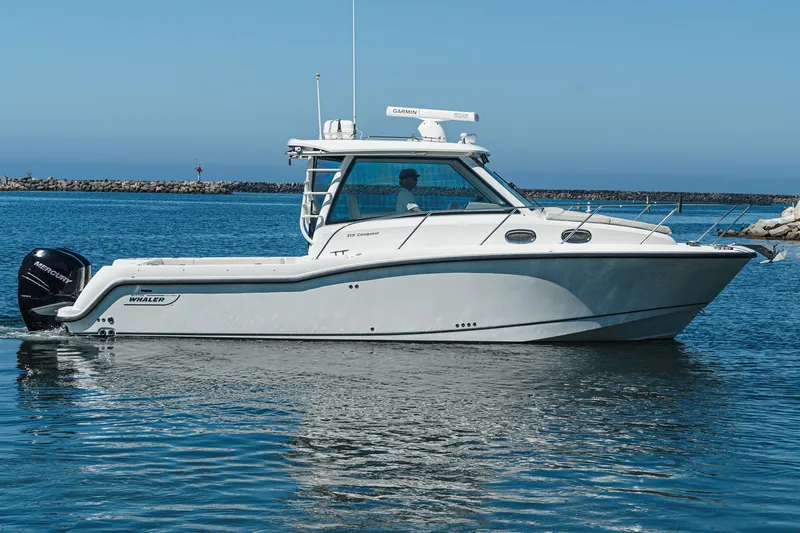Slide: The Image of 2016 Boston Whaler 315 Conquest boat cruising on calm waters. - 6