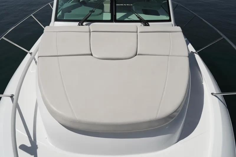 Slide: The Image of 2016 Boston Whaler 315 Conquest boat deck with cushioned seating. - 9