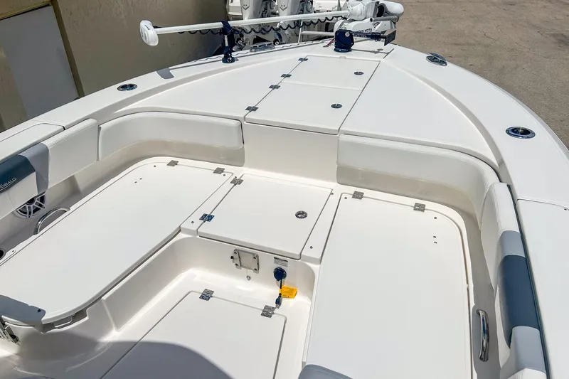 Slide: The Image of 2023 Robalo 266 Cayman boat deck with storage compartments and seating. - 11