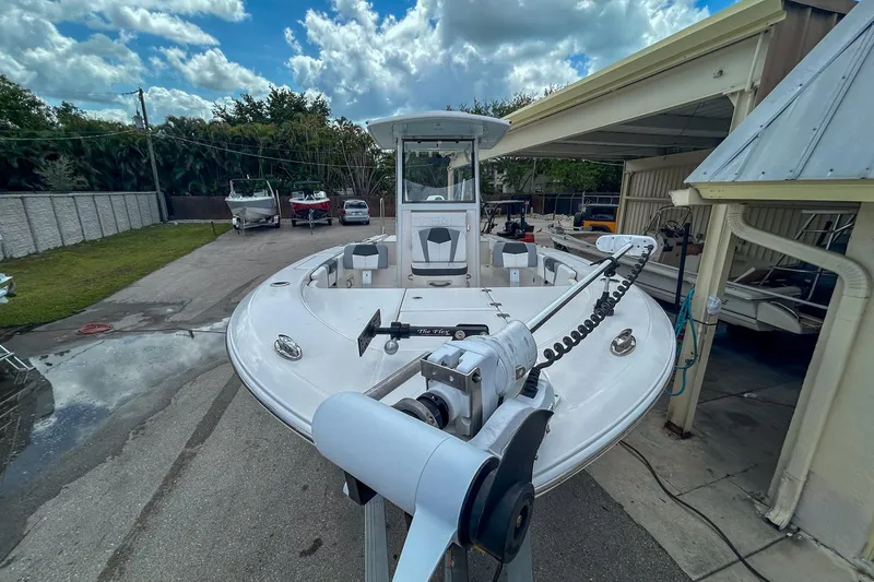 Slide: The Image of 2023 Robalo 266 Cayman boat docked, showcasing sleek design and advanced features. - 7