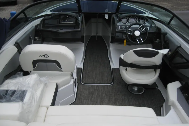 Slide: The Image of Interior of a 2015 Monterey 218SS Super Sport boat with modern seating and dashboard. - 10