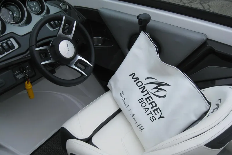 Slide: The Image of Interior of 2015 Monterey 218SS Super Sport boat with branded bag on seat. - 14