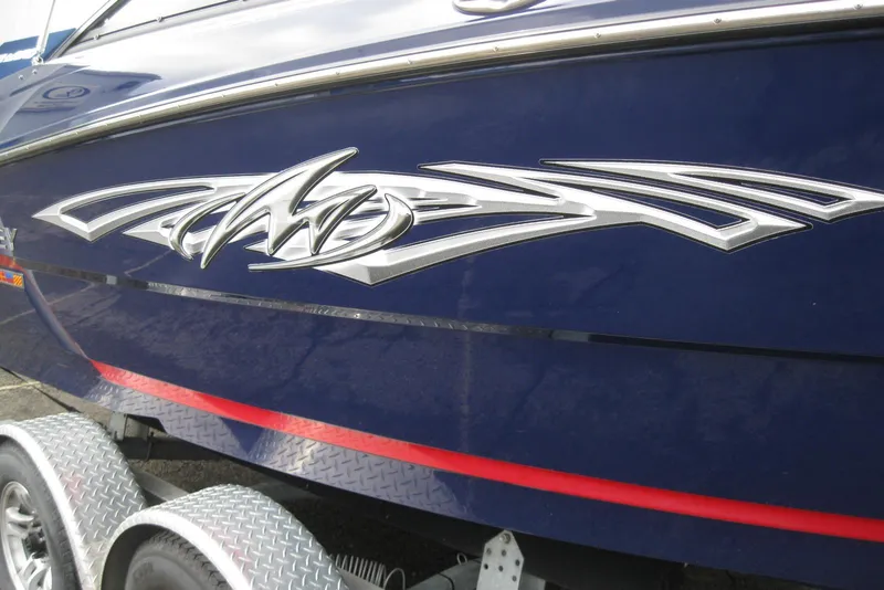 Slide: The Image of 2015 Monterey 218SS Super Sport boat with sleek design and logo detail. - 3