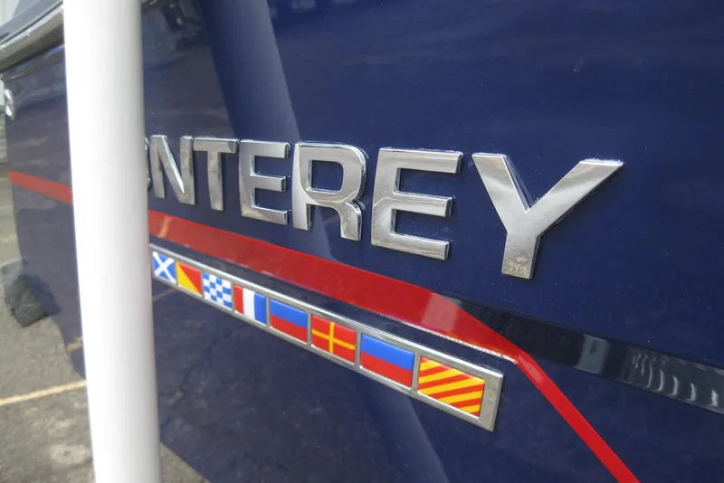 Slide: The Image of Close-up of 2015 Monterey 218SS Super Sport boat logo with nautical flags. - 4