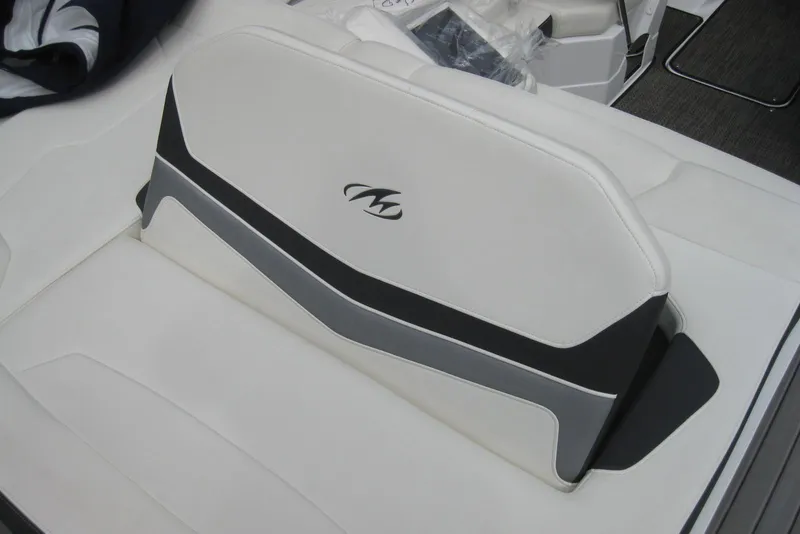 Slide: The Image of 2015 Monterey 218SS Super Sport boat seat with logo, featuring white and gray upholstery. - 9
