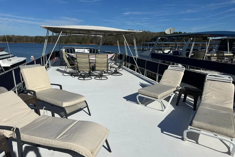 Slide: The Image of Spacious deck of 2000 Sumerset 16x73 houseboat with lounge chairs and seating area. - 18