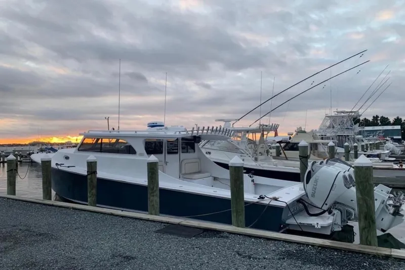 Slide: The Image of 2024 Composite Yacht CY 42 docked at marina during sunset. - 2