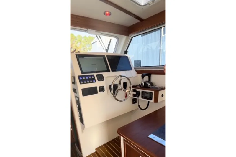 Slide: The Image of Helm of 2024 Composite Yacht CY 42 with modern navigation equipment and controls. - 5