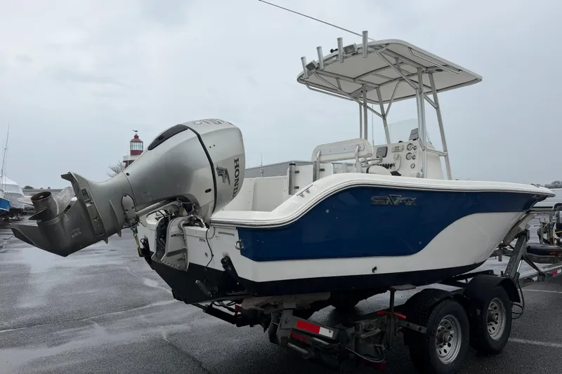 Slide: The Image of 2010 Sea Fox 216 Center Console boat on trailer with Honda outboard motor. - 11