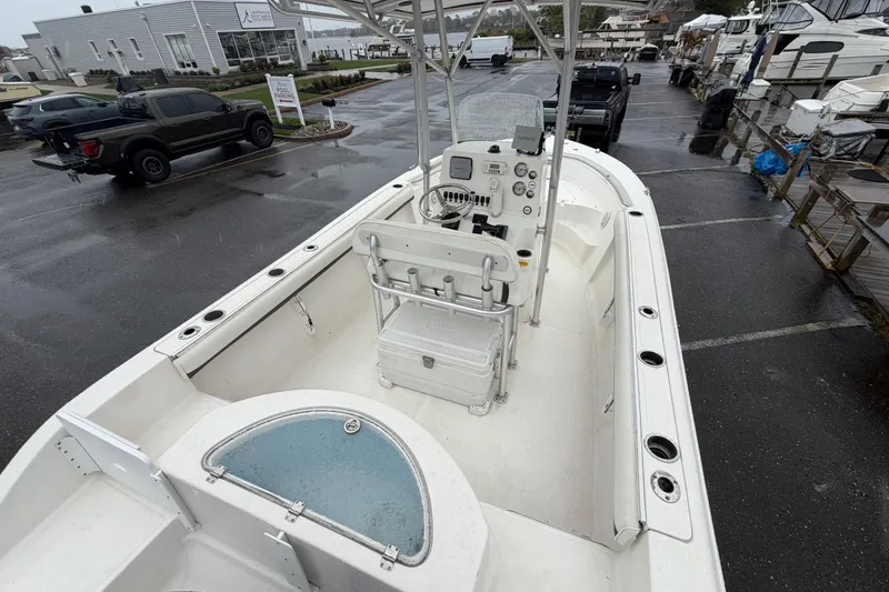 Slide: The Image of 2010 Sea Fox 216 Center Console boat in a marina parking lot on a rainy day. - 14