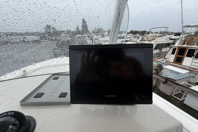 Slide: The Image of Rainy day on a 2010 Sea Fox 216 Center Console with Garmin display. - 18