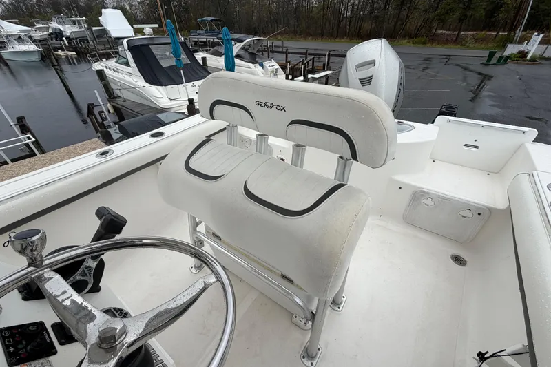 Slide: The Image of 2010 Sea Fox 216 Center Console boat interior with steering wheel and seating. - 20