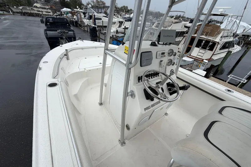 Slide: The Image of 2010 Sea Fox 216 Center Console boat with Garmin navigation at a marina. - 21