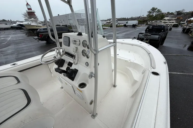 Slide: The Image of 2010 Sea Fox 216 Center Console boat interior with steering wheel and control panel. - 22