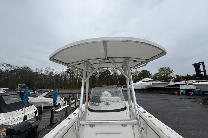 Slide: The Image of 2010 Sea Fox 216 Center Console boat docked on a rainy day. - 26