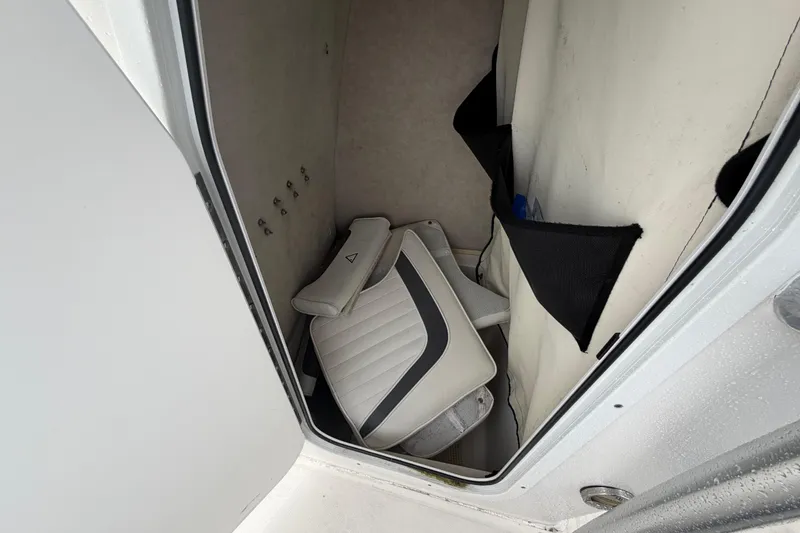 Slide: The Image of Storage compartment of a 2010 Sea Fox 216 Center Console boat with cushions inside. - 28