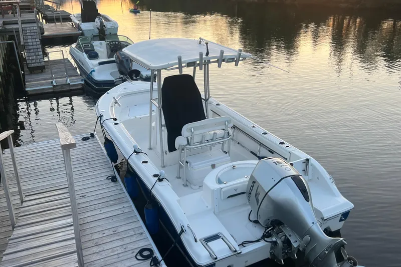 Slide: The Image of 2010 Sea Fox 216 Center Console boat docked at sunset. - 7