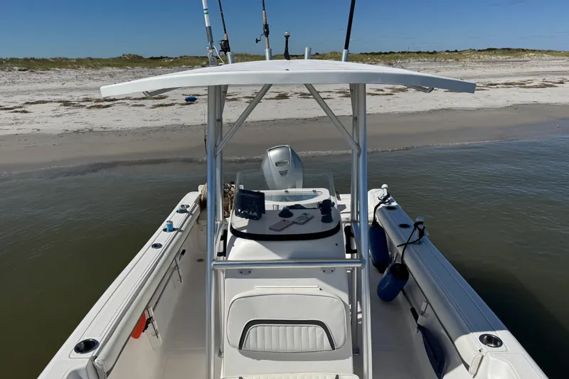 Slide: The Image of 2010 Sea Fox 216 Center Console boat docked on a sandy beach. - 8