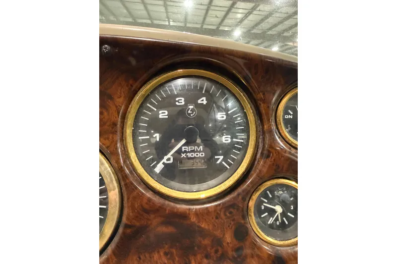Slide: The Image of Close-up of 2002 Rinker Fiesta Vee 342 RPM gauge, showing detailed dashboard design. - 12